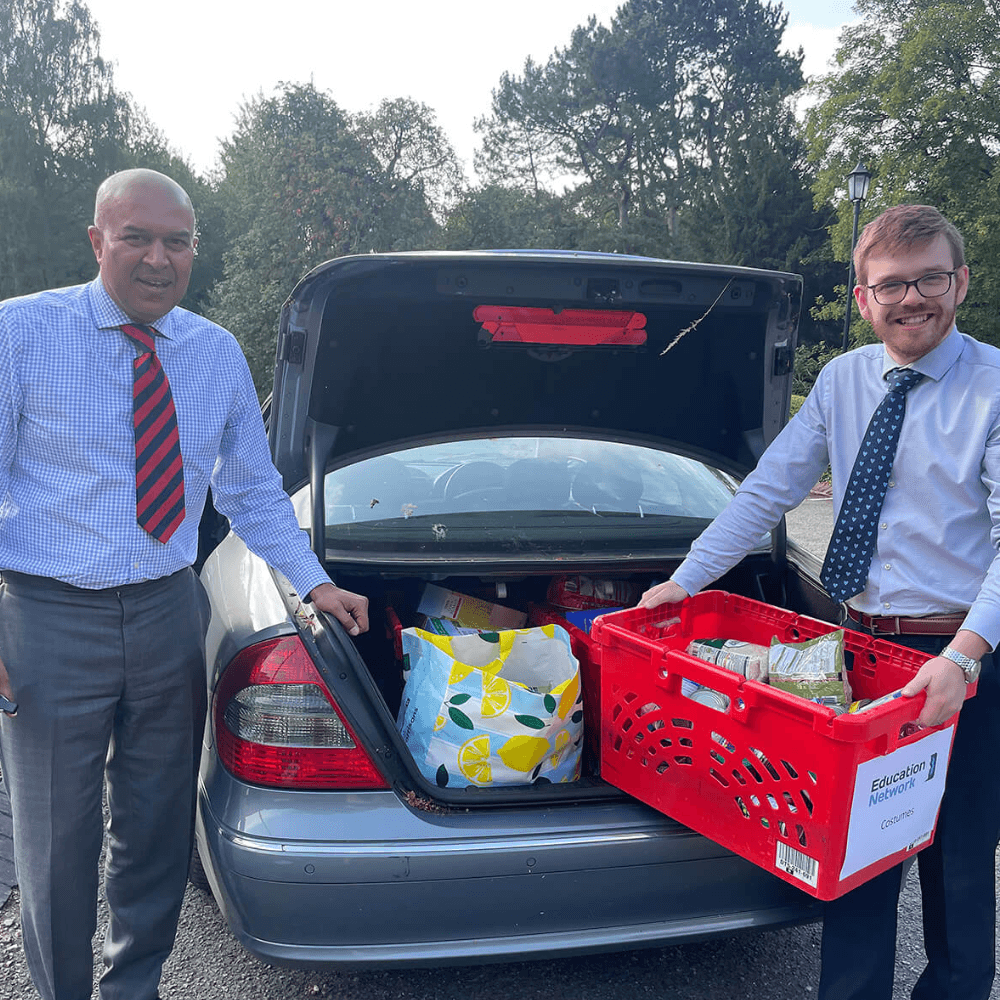 Manny and Harry giving food hampers to families during the school holidays