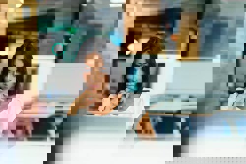 woman looking at her computer screen